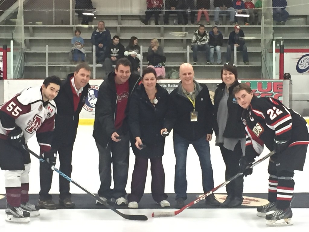 Chatham Maroon President - Bill Szekesy, Chatham Goodfellows - Tim Haskell, Rose Peseski and Dave Palmer and Amanda Thibodeau perform the ceremonial "puck drop" at centre ice yesterday afternoon at the Chatham Maroon hockey game.